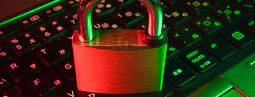 red padlock on black computer keyboard