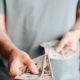 Free Crop man paying with American dollars Stock Photo